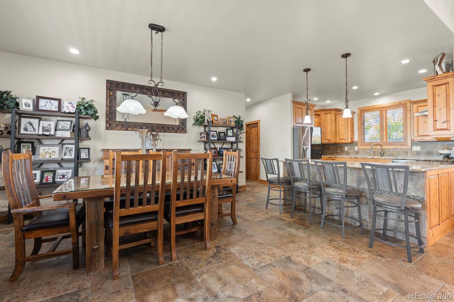 60075 Oak Grove Road Montrose, CO 81403 - Photo 13 of 50 a view of a dining room with furniture