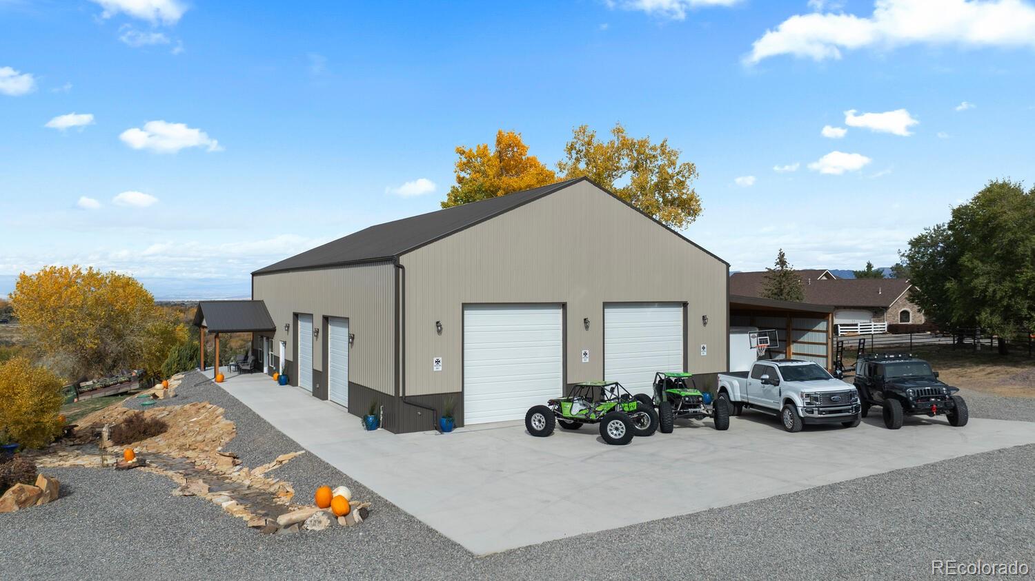 60075 Oak Grove Road Montrose, CO 81403 - Photo 26 of 50 a view of a house with a patio