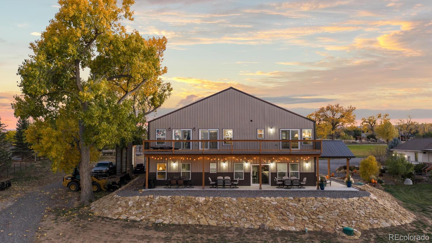 60075 Oak Grove Road Montrose, CO 81403 - Photo 4 of 50 a front view of a house with a yard