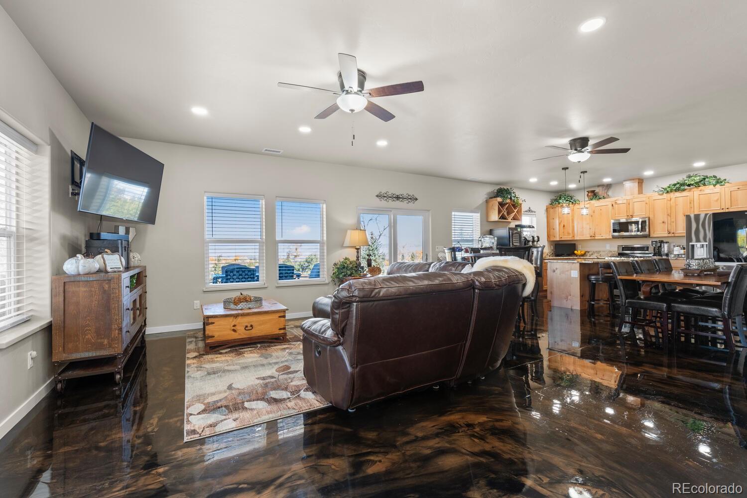 60075 Oak Grove Road Montrose, CO 81403 - Photo 5 of 50 a living room with lots of furniture and kitchen view