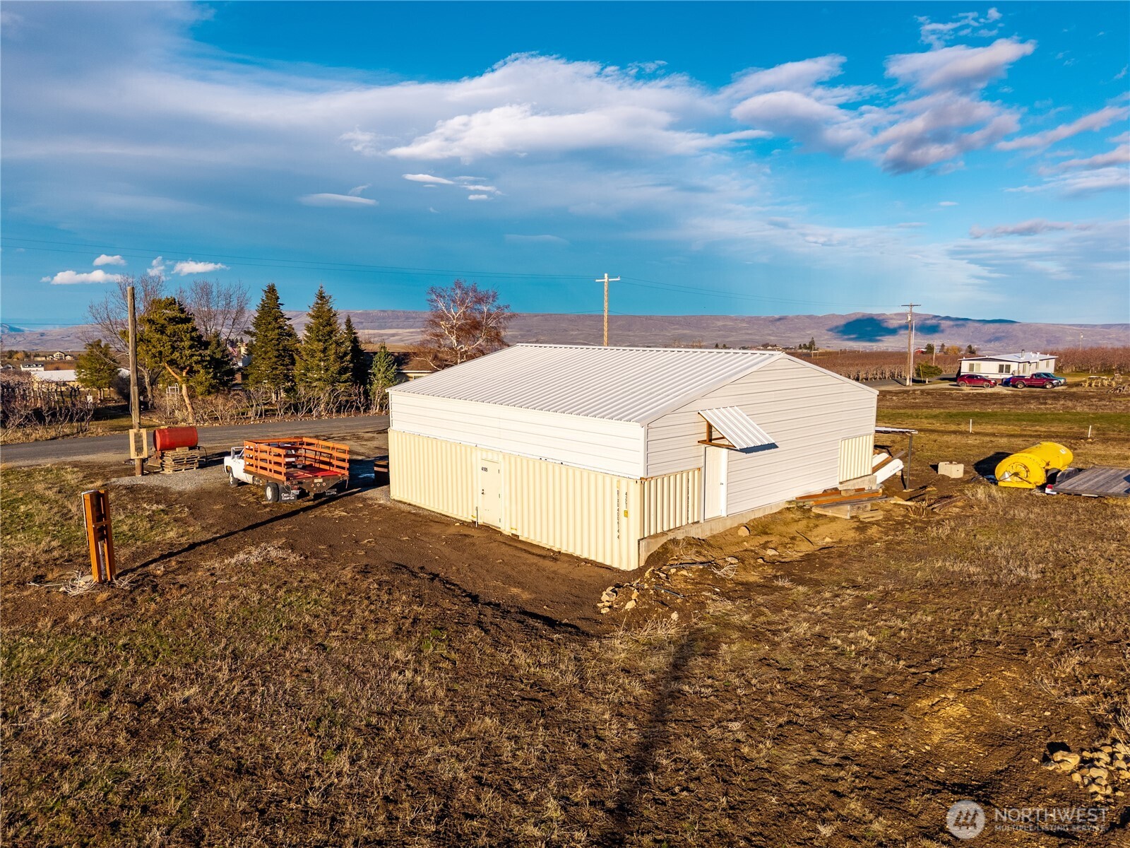 4105 Jim Smith Road Wenatchee, WA 98801 - Photo 3 of 9 a view of a dry yard with wooden fence
