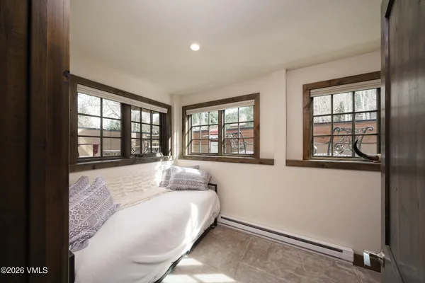 a room with wooden floor and furniture