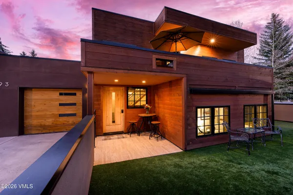 a view of an house with backyard porch and wooden floor