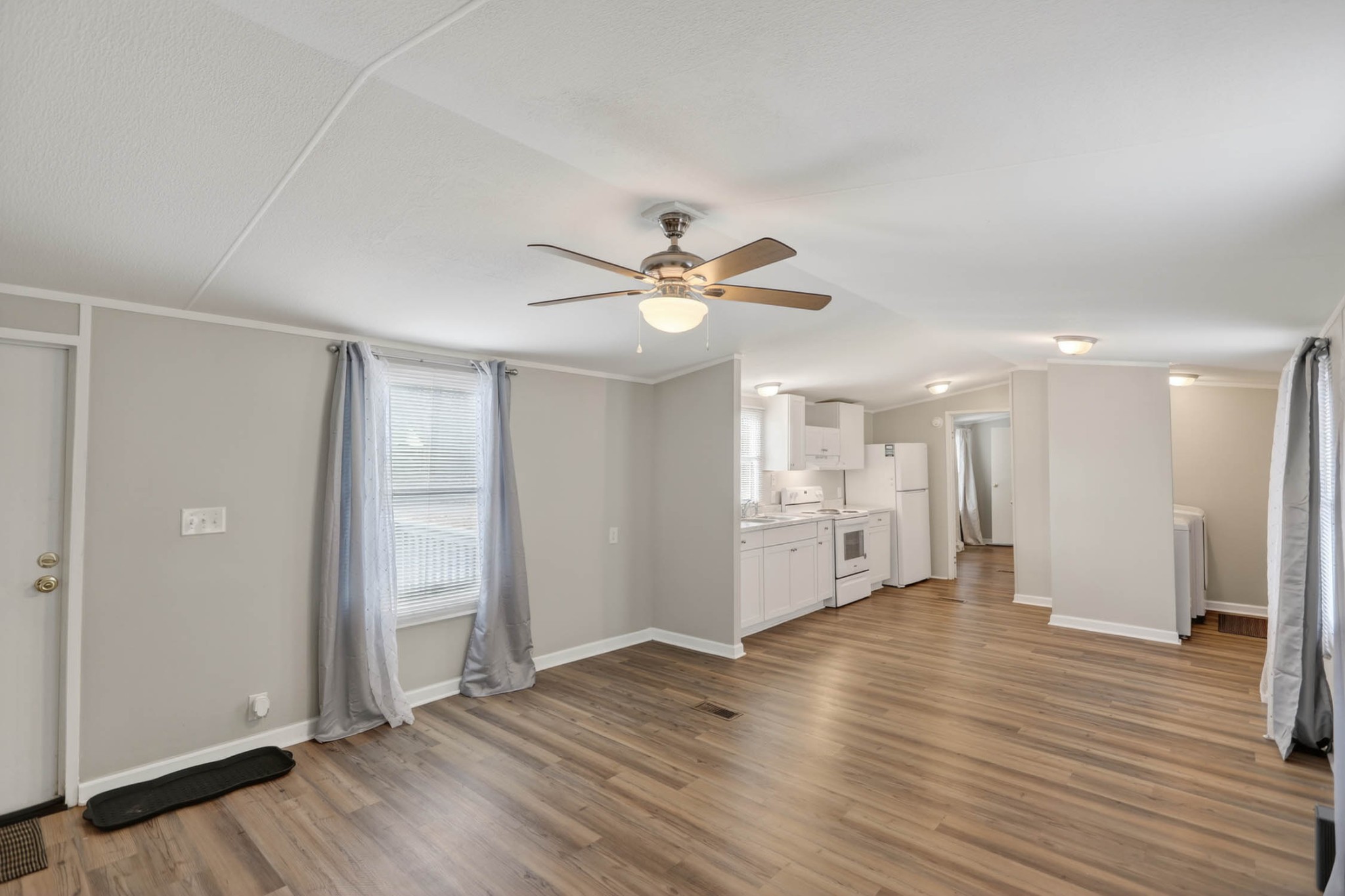 4337 Woodrow Wilson Road White House, TN 37188 - Photo 13 of 28 an empty room with wooden floor and ceiling fan