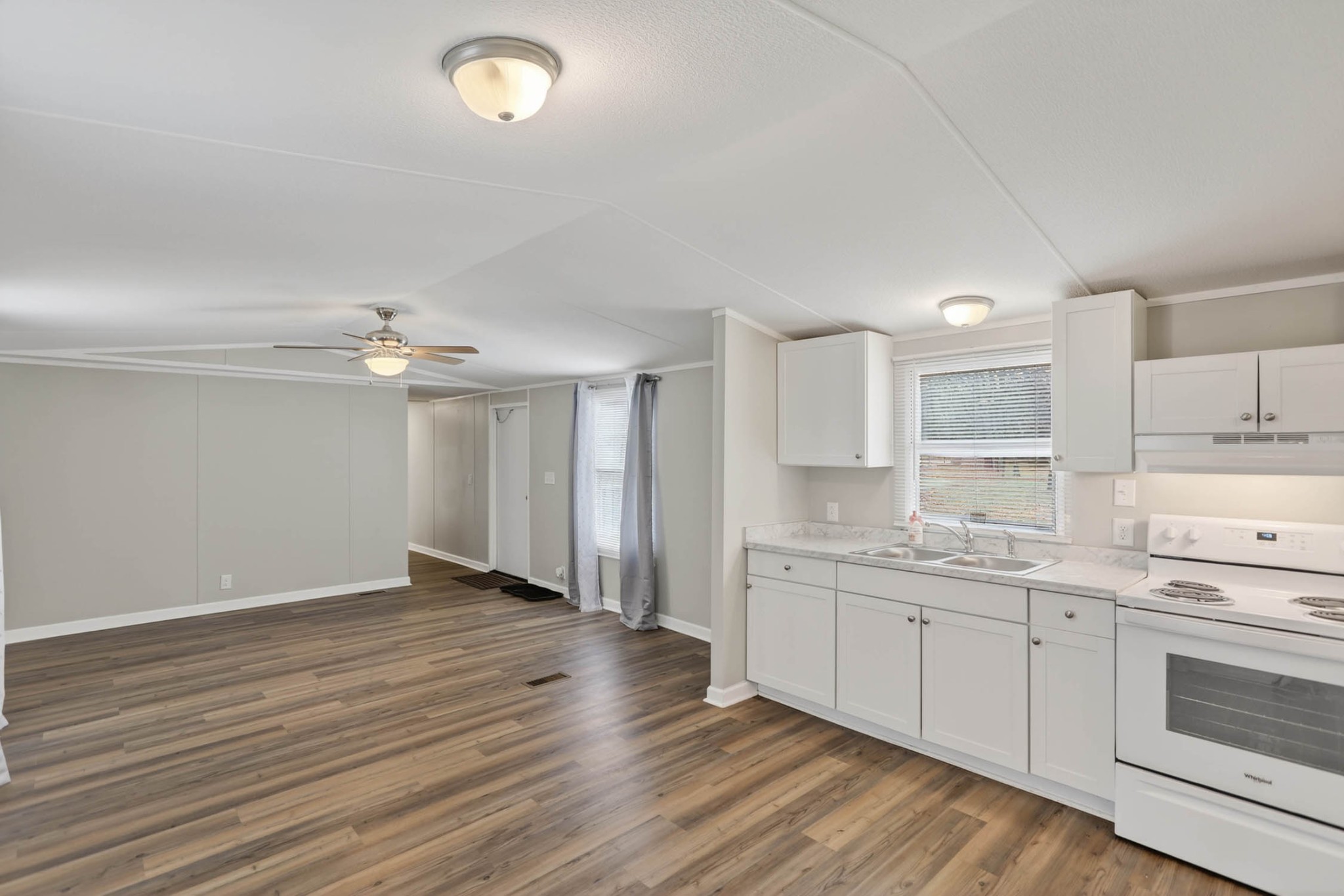 4337 Woodrow Wilson Road White House, TN 37188 - Photo 15 of 28 a kitchen with a sink cabinets and wooden floor