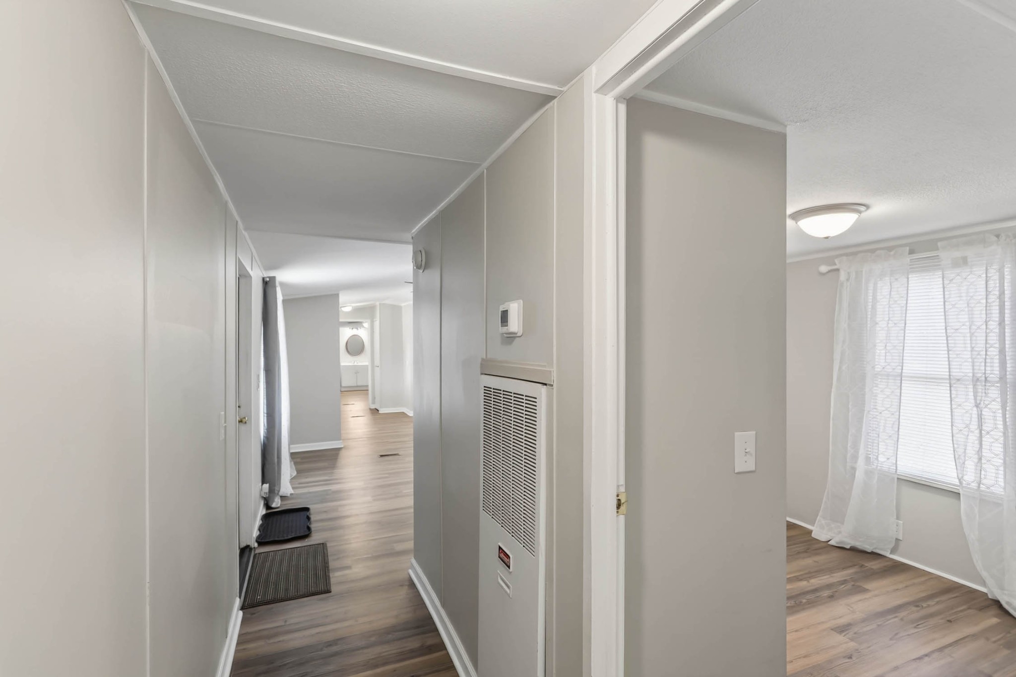 4337 Woodrow Wilson Road White House, TN 37188 - Photo 10 of 28 a view of a hallway with wooden floor and closet area