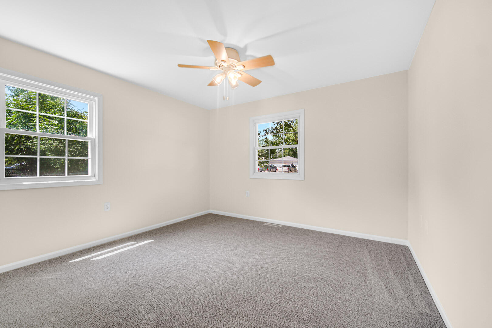 739 Fremont Road Valparaiso, IN 46385 - Photo 14 of 26 an empty room with a window and a fan