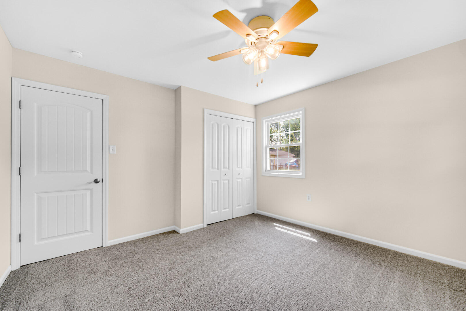 739 Fremont Road Valparaiso, IN 46385 - Photo 15 of 26 an empty room with a ceiling fan and a window