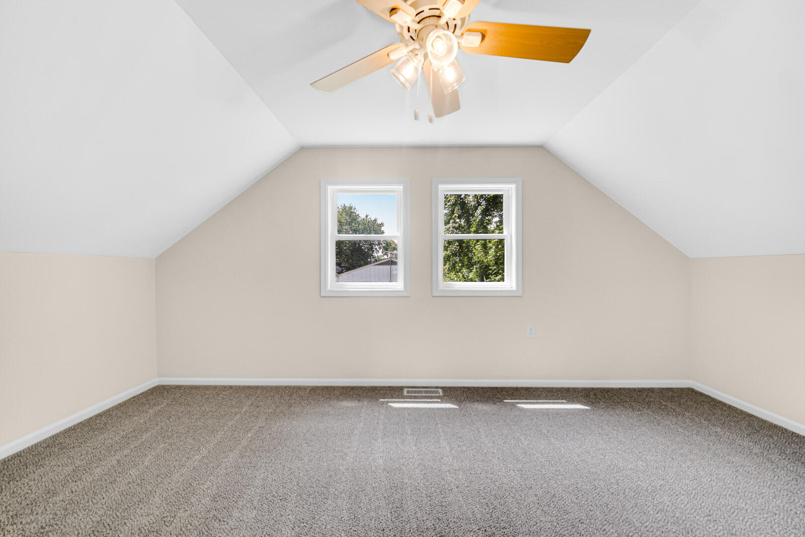 739 Fremont Road Valparaiso, IN 46385 - Photo 17 of 26 an empty room with a window and a chandelier fan