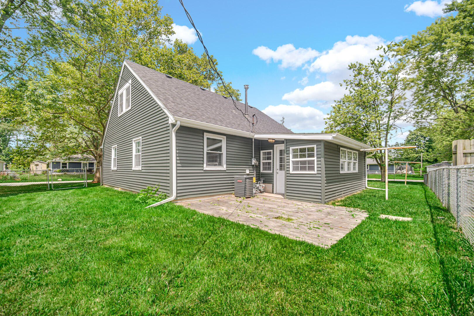 739 Fremont Road Valparaiso, IN 46385 - Photo 23 of 26 a view of a yard in front of a house with plants and large tree