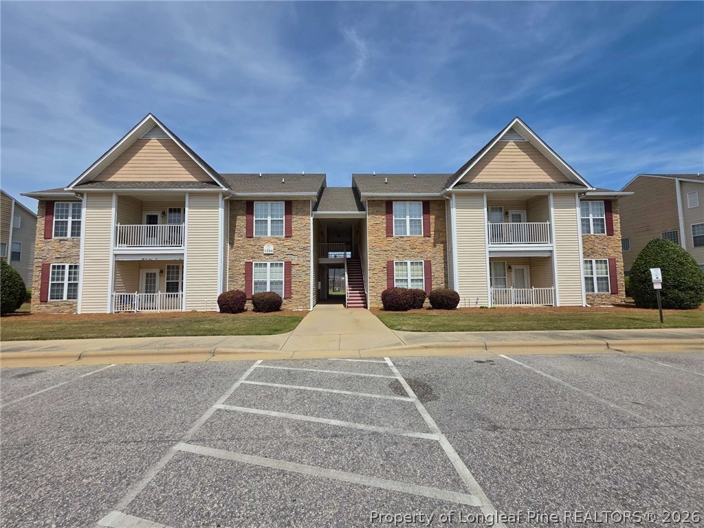 1324 Kershaw Loop, Unit 206 Fayetteville, NC 28314 - Photo 1 of 26 a front view of a house with a yard