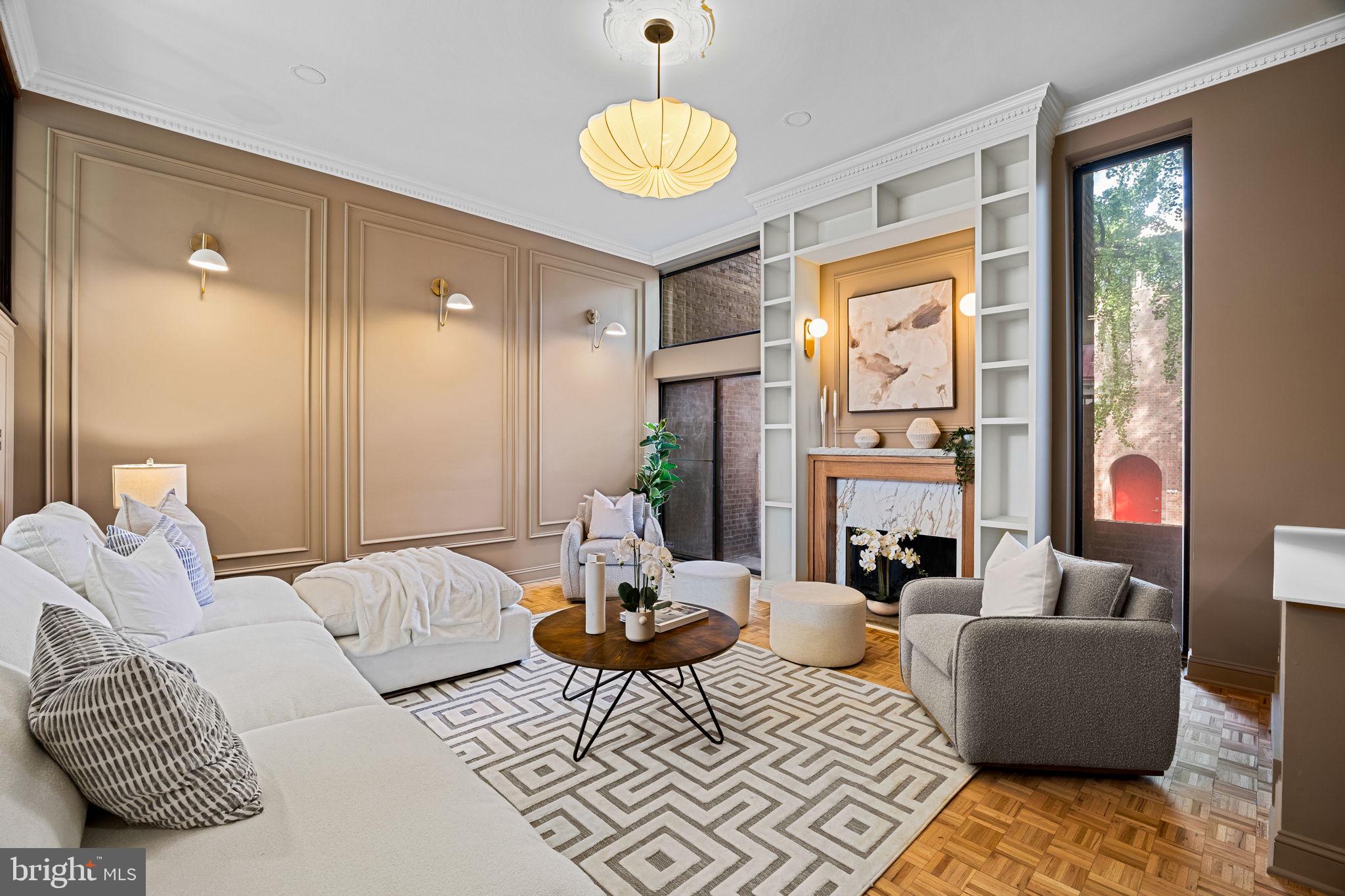 242 Locust Street Philadelphia, PA 19106 - Photo 19 of 62 a living room with furniture fireplace and a large window