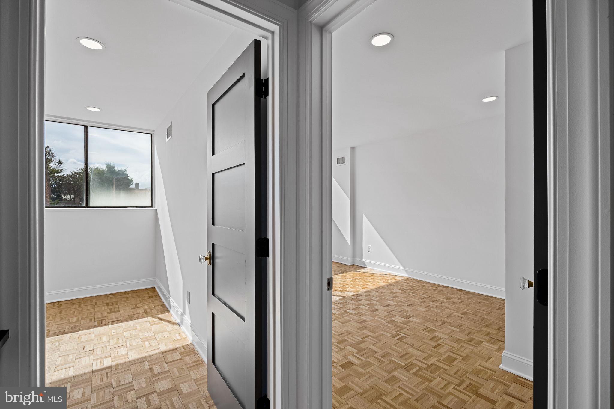 242 Locust Street Philadelphia, PA 19106 - Photo 23 of 62 a view of a hallway with wooden floor and a bathroom