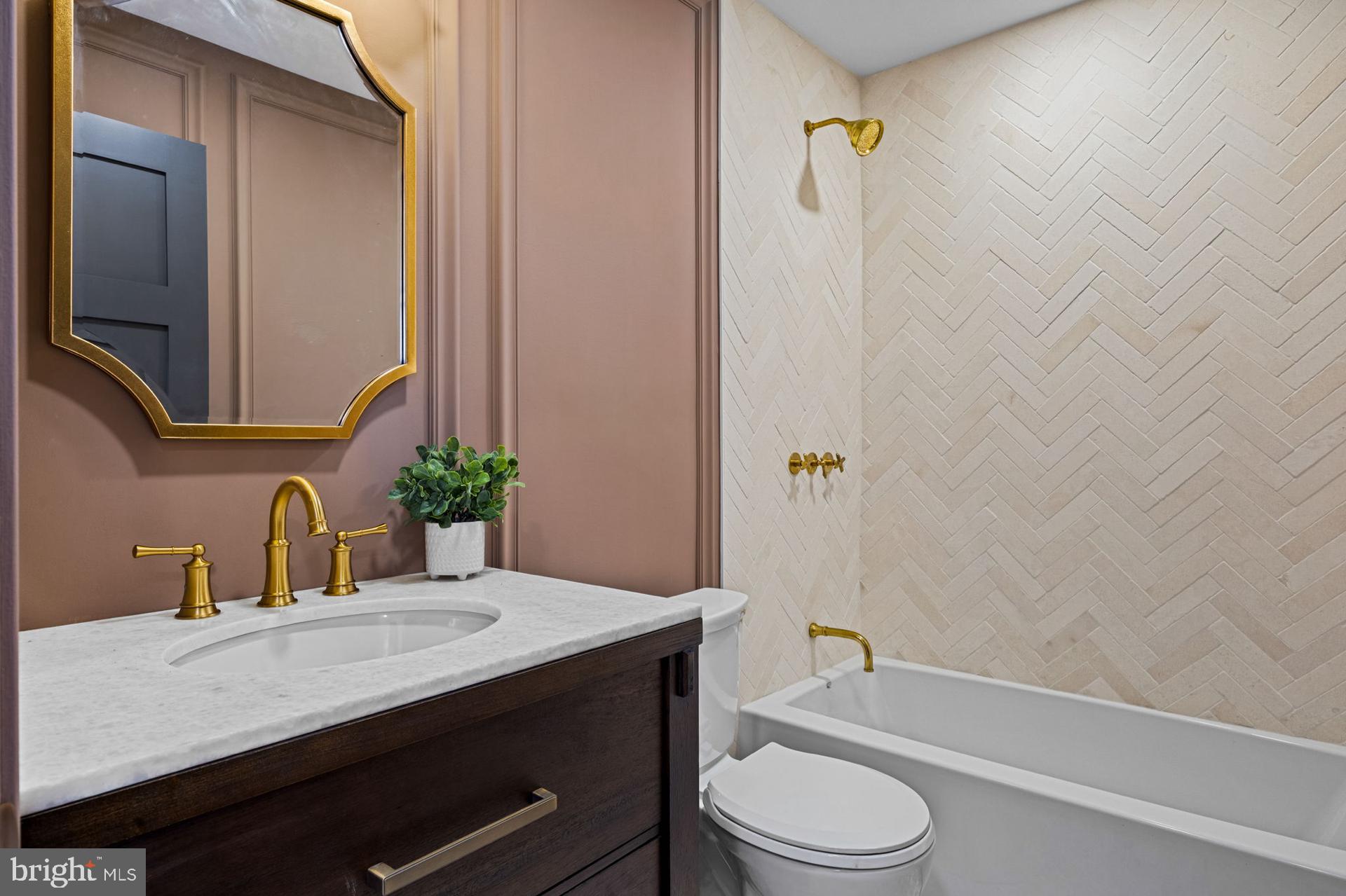 242 Locust Street Philadelphia, PA 19106 - Photo 24 of 62 a bathroom with a granite countertop sink toilet a mirror and shower