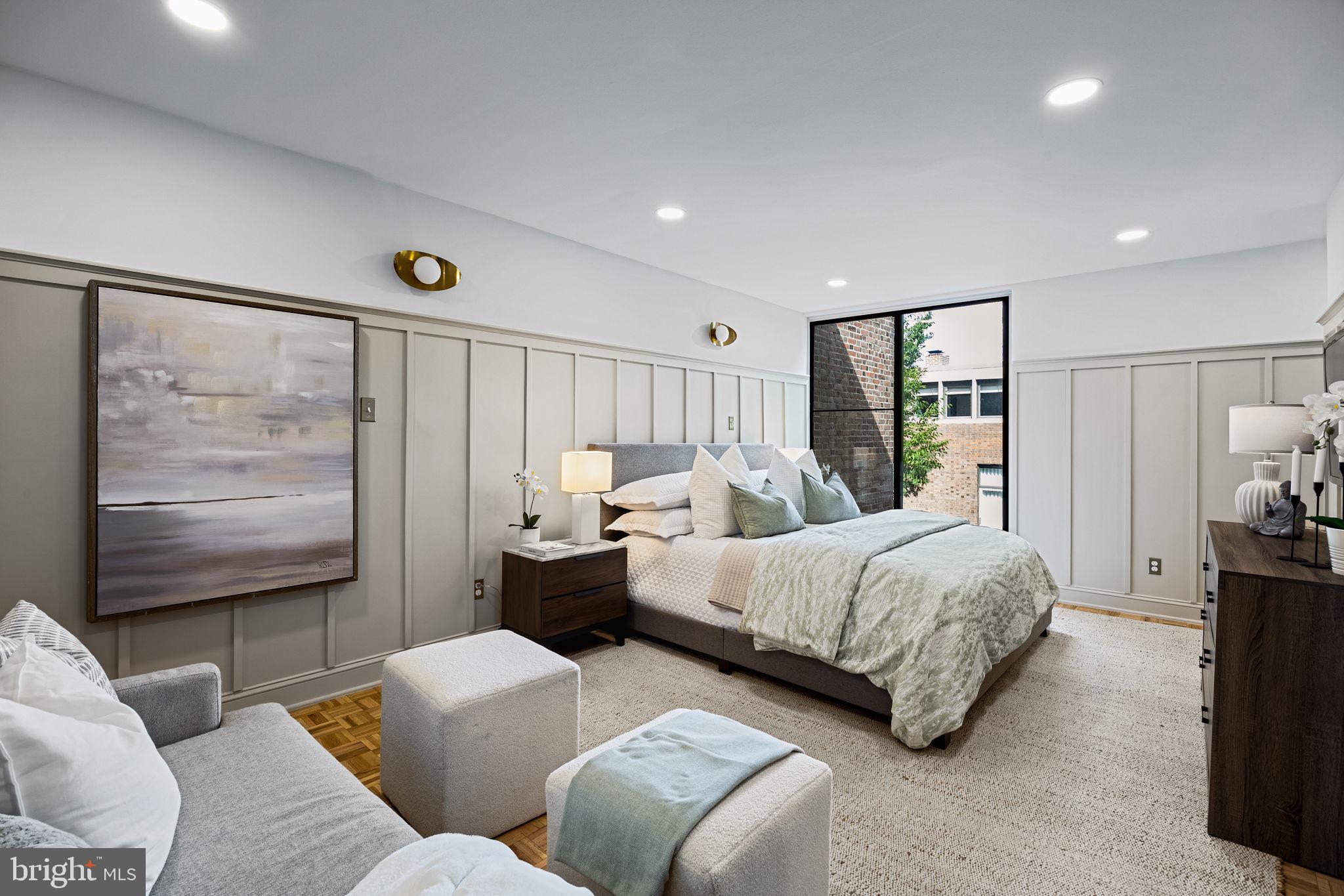 242 Locust Street Philadelphia, PA 19106 - Photo 29 of 62 a bedroom with two beds and a large window