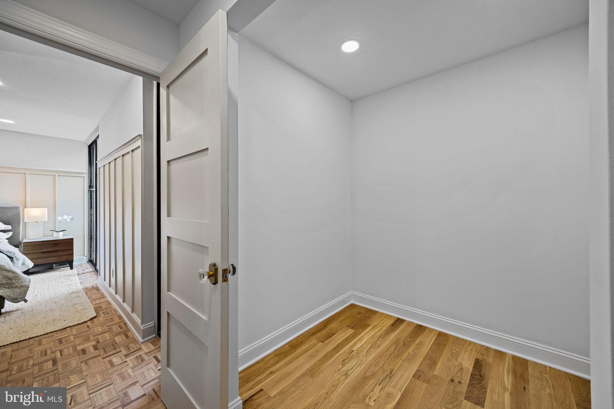 242 Locust Street Philadelphia, PA 19106 - Photo 35 of 62 a view of a hallway with bathroom and wooden floor