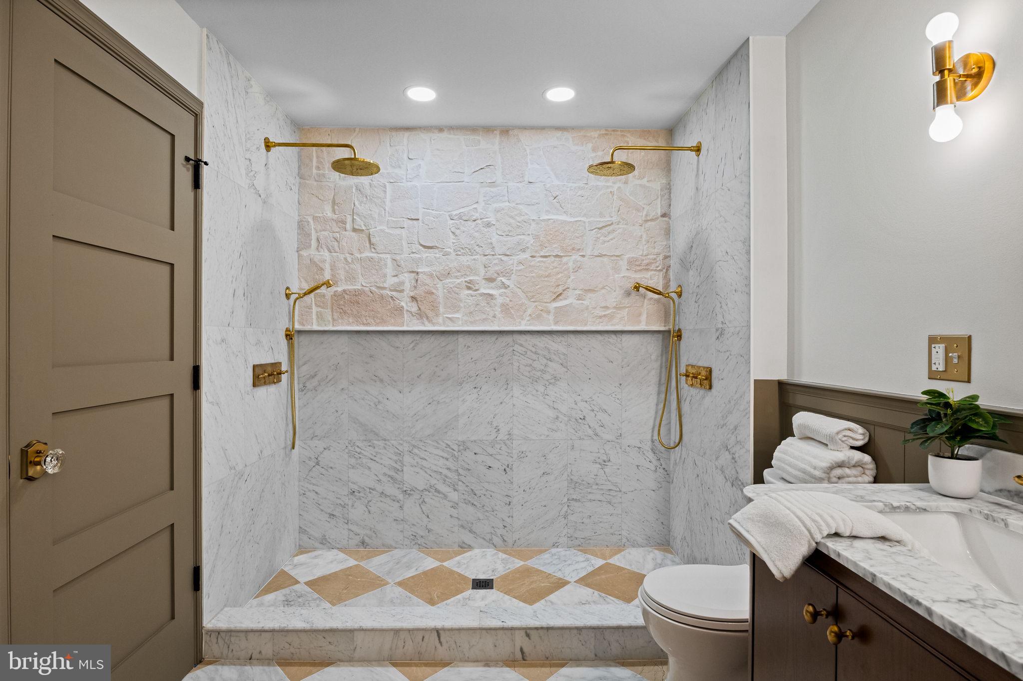 242 Locust Street Philadelphia, PA 19106 - Photo 40 of 62 a bathroom with a granite countertop sink a toilet and shower