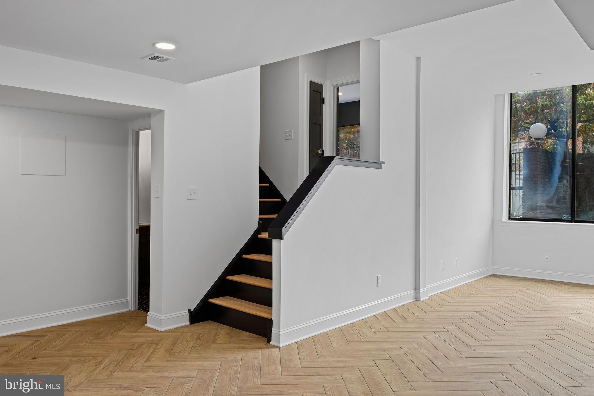 242 Locust Street Philadelphia, PA 19106 - Photo 45 of 62 a view of entryway with wooden floor and staircase