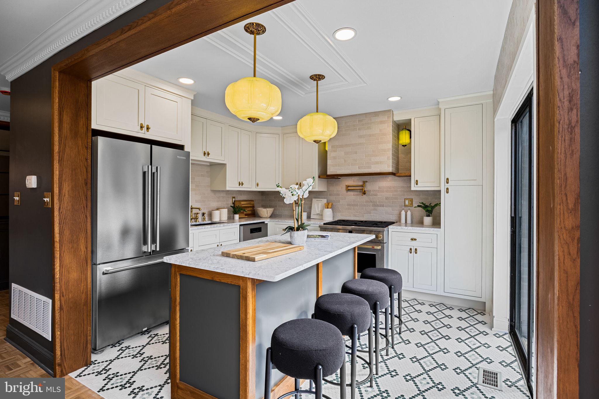 242 Locust Street Philadelphia, PA 19106 - Photo 5 of 62 a kitchen with stainless steel appliances granite countertop a sink a stove a refrigerator and island