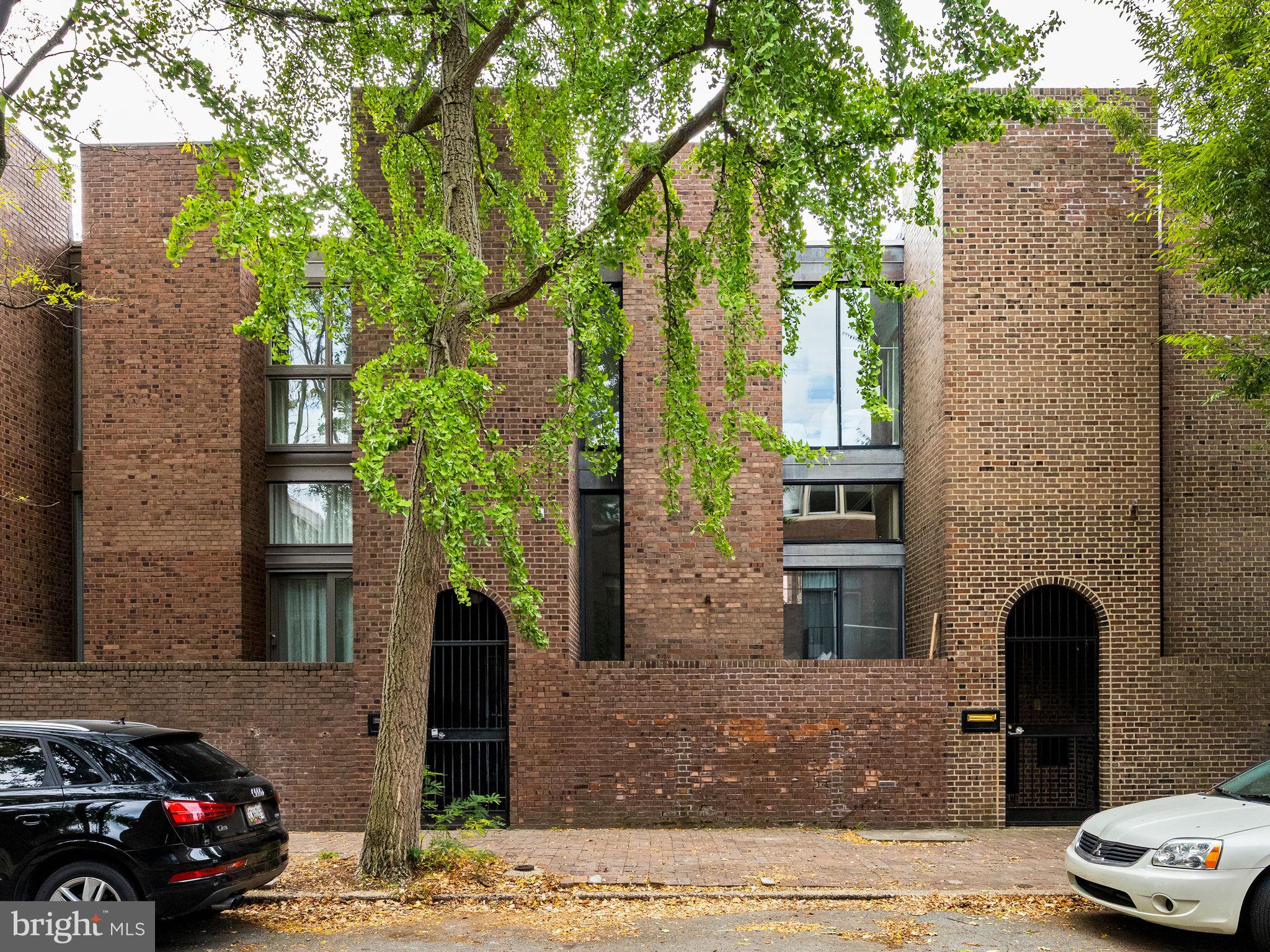 242 Locust Street Philadelphia, PA 19106 - Photo 56 of 62 a car parked in front of a brick house