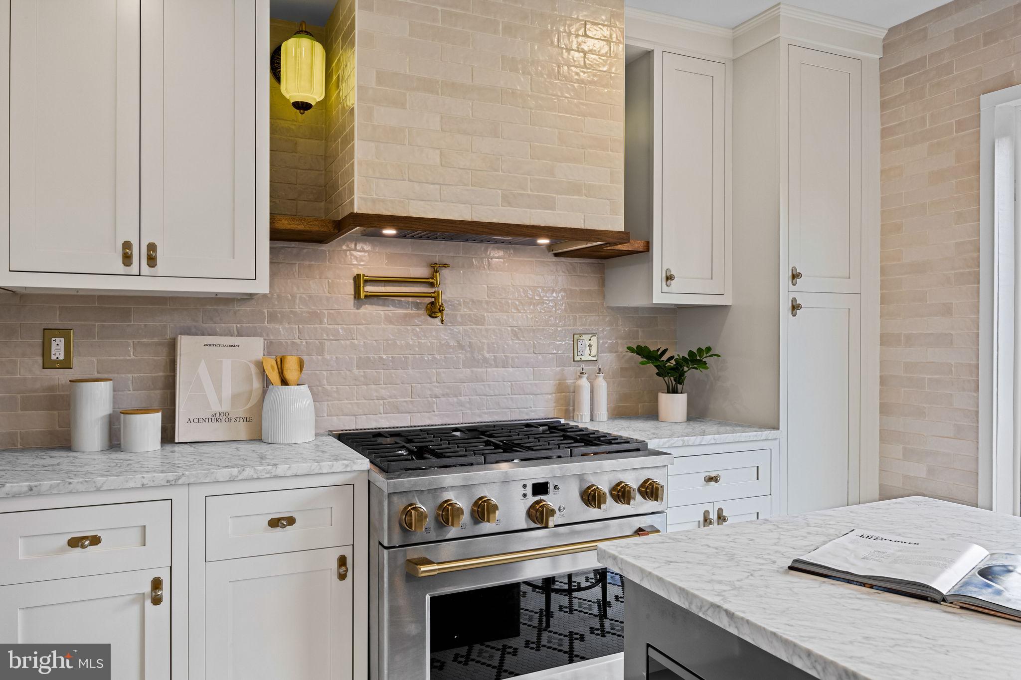 242 Locust Street Philadelphia, PA 19106 - Photo 7 of 62 a kitchen with granite countertop a stove and a sink