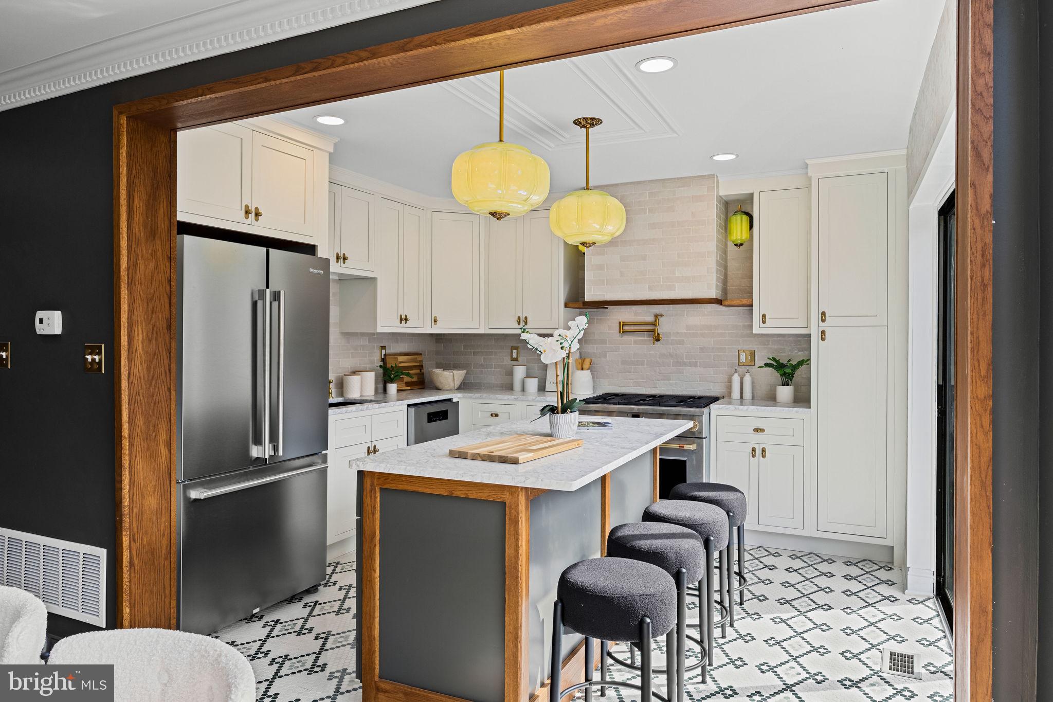 242 Locust Street Philadelphia, PA 19106 - Photo 9 of 62 a kitchen with stainless steel appliances granite countertop a sink refrigerator and cabinets