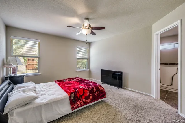 a bedroom with a bed and a fireplace
