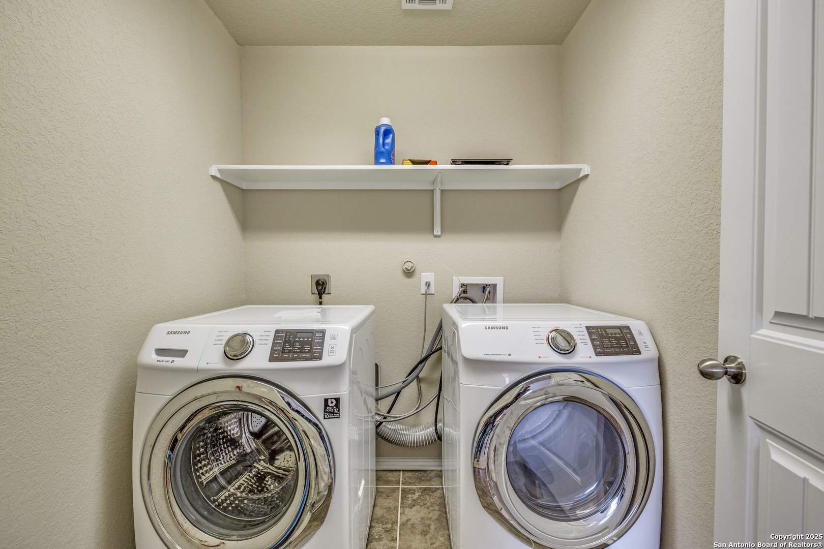 10415 Rhyder Ridge San Antonio, TX 78254 - Photo 16 of 25 a utility room with dryer and washer