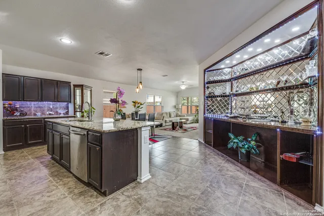 a kitchen with stove and cabinets