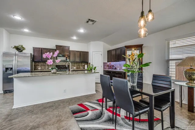 a dining room with furniture and window