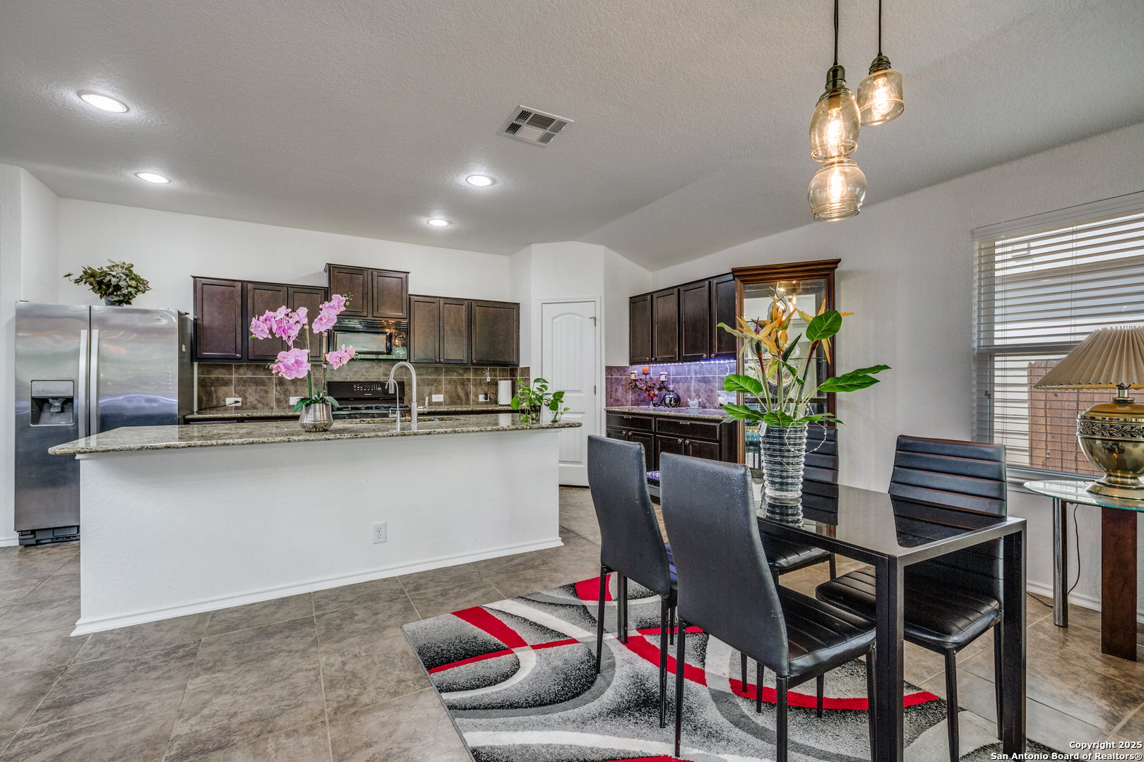 10415 Rhyder Ridge San Antonio, TX 78254 - Photo 7 of 25 a dining room with furniture and window