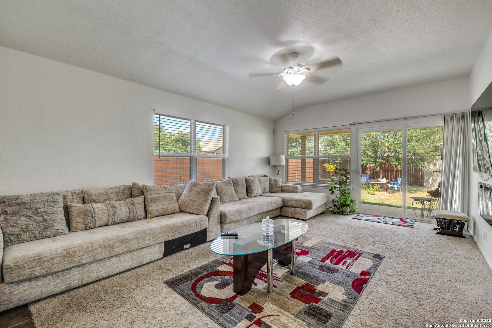 10415 Rhyder Ridge San Antonio, TX 78254 - Photo 8 of 25 a living room with furniture and a large window