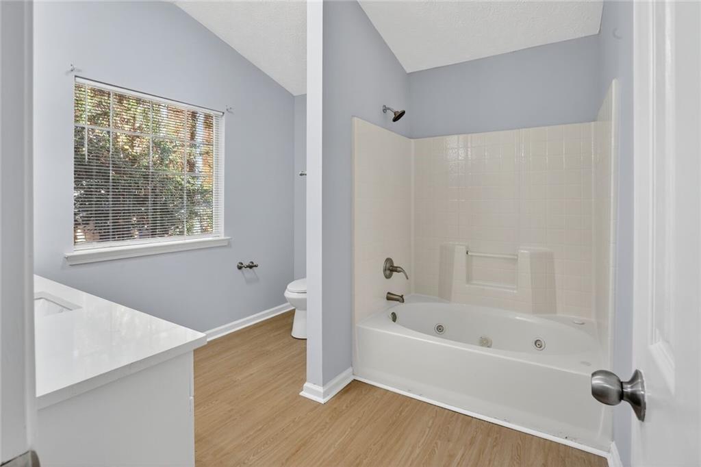 218 Nicki Court Hampton, GA 30228 - Photo 14 of 17 a white bath tub sitting next to a window