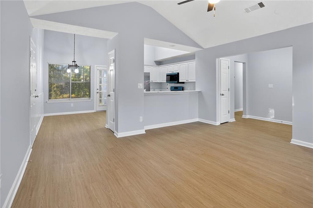 218 Nicki Court Hampton, GA 30228 - Photo 6 of 17 a view of livingroom with wooden floor and window