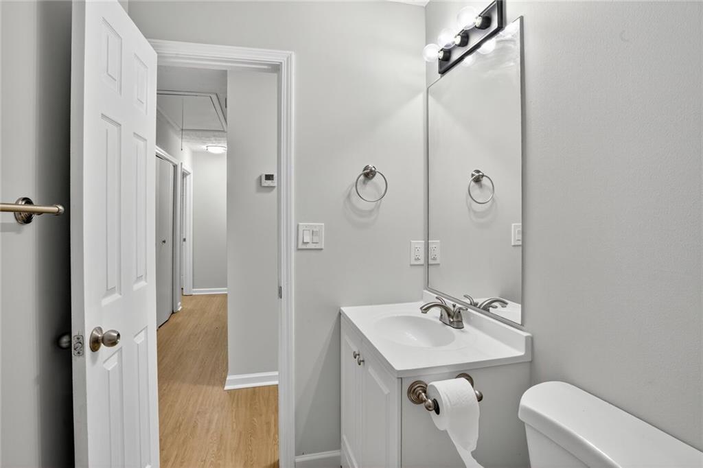 218 Nicki Court Hampton, GA 30228 - Photo 10 of 17 a bathroom with a sink a toilet a mirror and shower