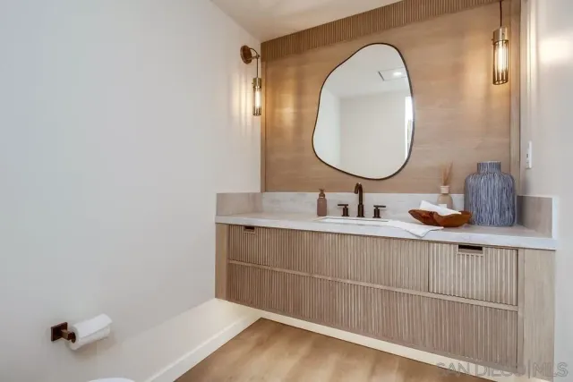 a bathroom with a sink and a mirror