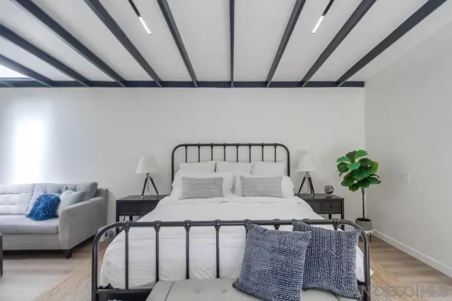 a living room with furniture and flowers