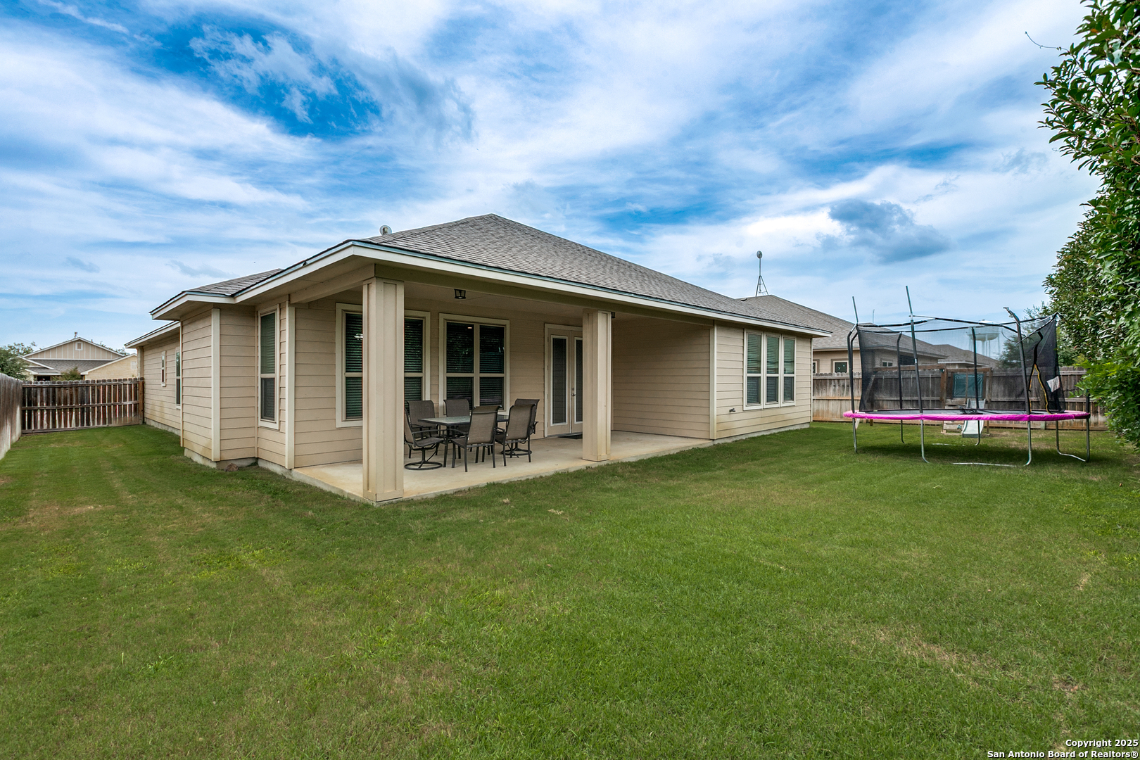 305 Iron Gate Pleasanton, TX 78064 - Photo 24 of 25 a view of a house with a yard