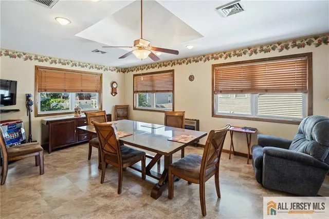 a view of a dining room with furniture window and outside view