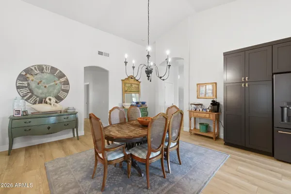 a dining room with furniture and window