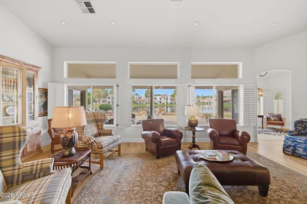 a living room with furniture and a large window