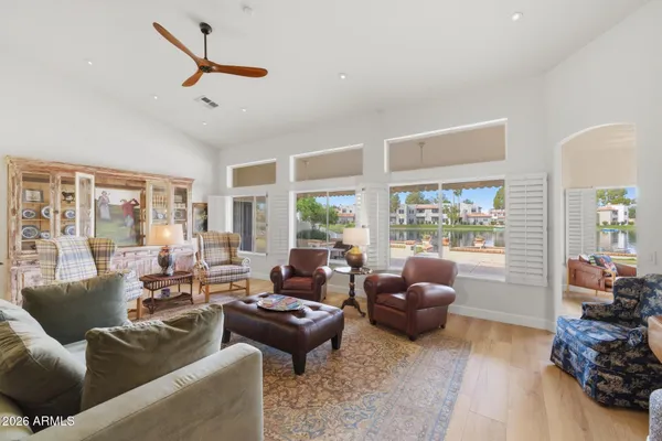 a living room with furniture and a large window