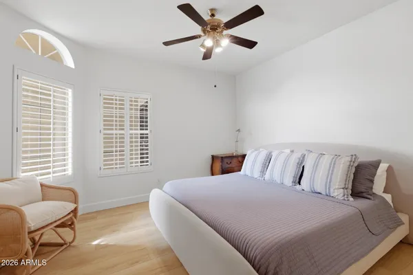 a bedroom with a bed and a couch