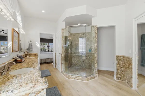 a large bathroom with a glass shower door