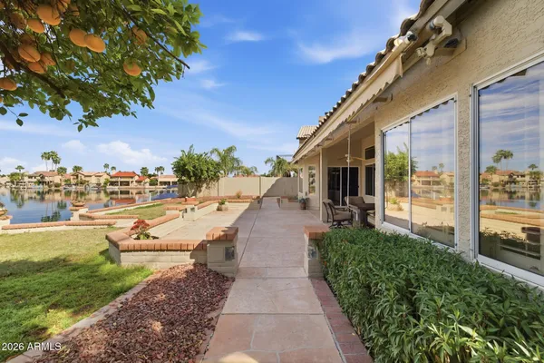 a view of a patio with table and chairs and potted plants