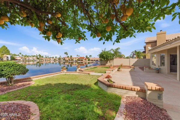 a view of a backyard with swimming pool