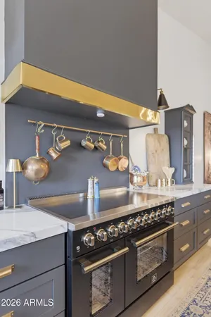 a kitchen with a stove and cabinets