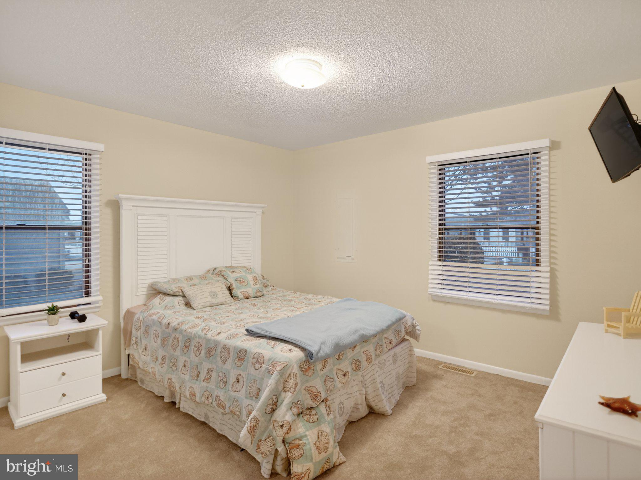 103 Channel Buoy Road Ocean City, MD 21842 - Photo 25 of 29 Cozy bedroom with natural light.