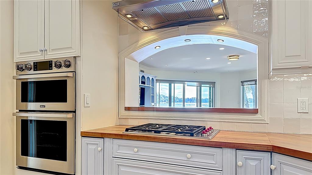 660 Osceola Avenue, Unit 101 Winter Park, FL 32789 - Photo 12 of 65 a kitchen with stainless steel appliances a stove and a microwave