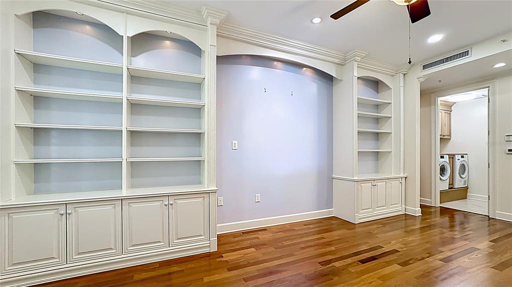 660 Osceola Avenue, Unit 101 Winter Park, FL 32789 - Photo 18 of 65 a view of an empty room with a window and wooden floor